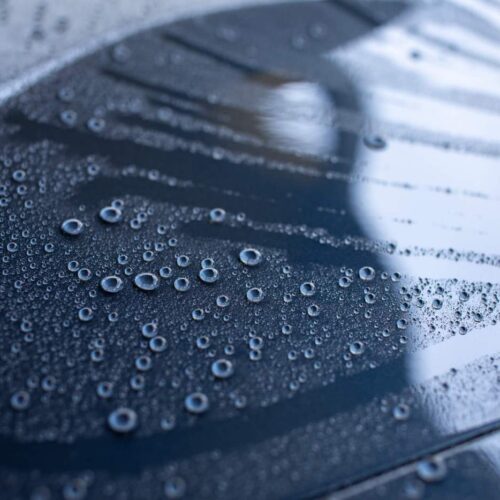 Water repellent car hood with nano ceramic spray